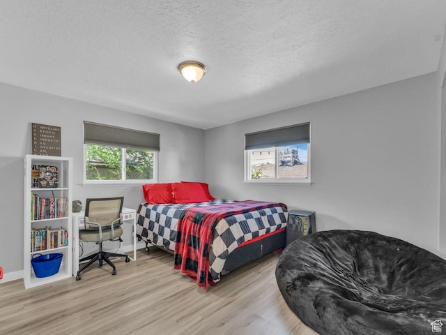 4273 W Annapolis Dr S, West Valley City, UT 84120 - bedroom with wood finished floors and a textured ceiling