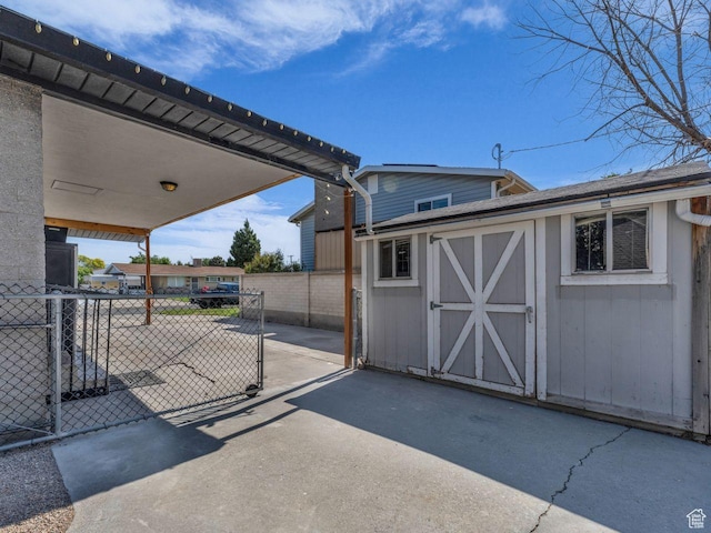 4273 W Annapolis Dr S, West Valley City, UT 84120 - view of patio featuring a storage unit