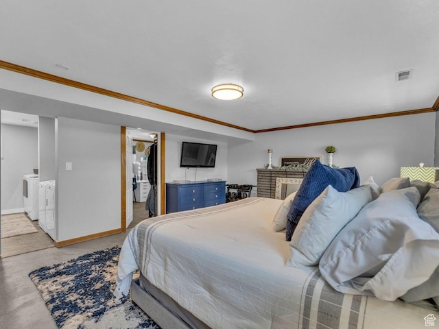 4273 W Annapolis Dr S, West Valley City, UT 84120 - bedroom featuring crown molding, washer and dryer, and a fireplace