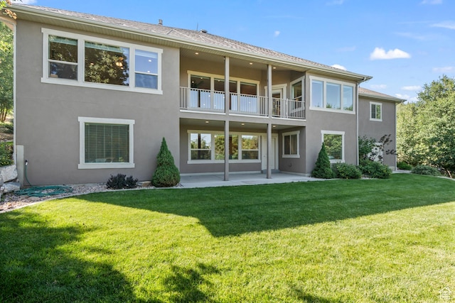 1155 S Eagle Nest Dr, Woodland Hills, UT 84653 - back of house featuring a balcony, stucco siding, a patio area, and a lawn