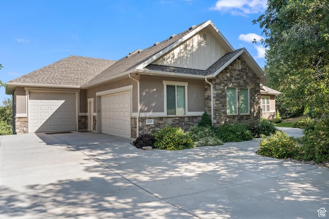 1155 S Eagle Nest Dr, Woodland Hills, UT 84653 - view of front of house with stone siding, an attached garage, and concrete driveway