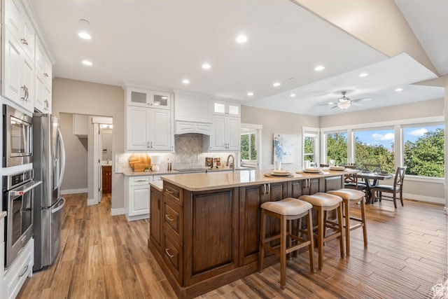1155 S Eagle Nest Dr, Woodland Hills, UT 84653 - kitchen featuring appliances with stainless steel finishes, an island with sink, white cabinetry, and recessed lighting