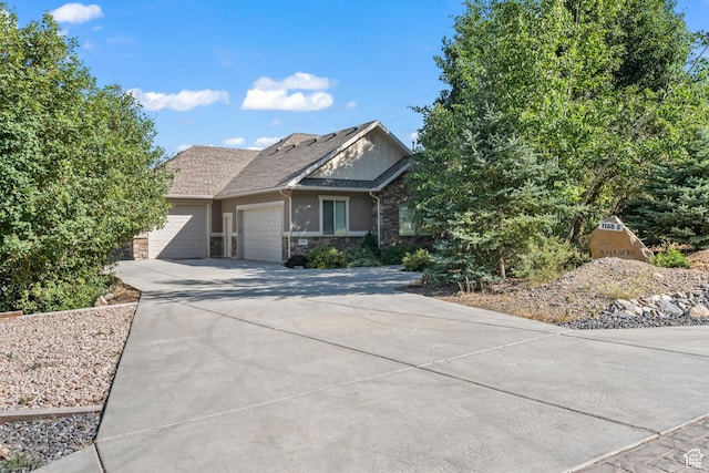 1155 S Eagle Nest Dr, Woodland Hills, UT 84653 - view of front of house with a garage, stone siding, and concrete driveway