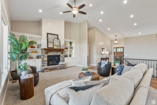 1155 S Eagle Nest Dr, Woodland Hills, UT 84653 - carpeted living area with high vaulted ceiling, a ceiling fan, recessed lighting, and a stone fireplace