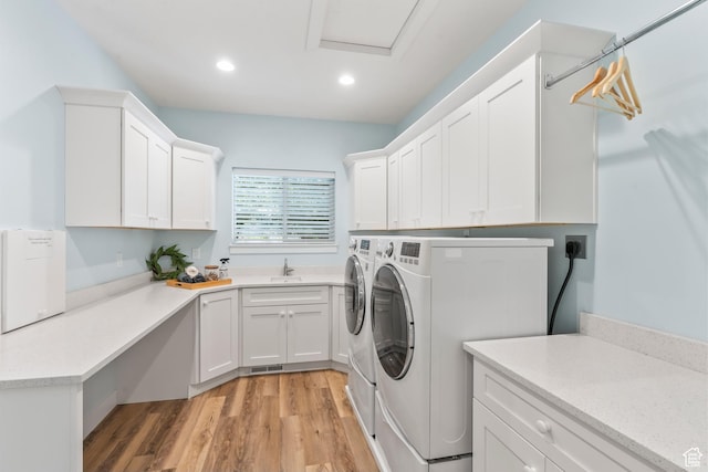1155 S Eagle Nest Dr, Woodland Hills, UT 84653 - laundry area featuring washer and clothes dryer, cabinet space, light wood finished floors, and recessed lighting