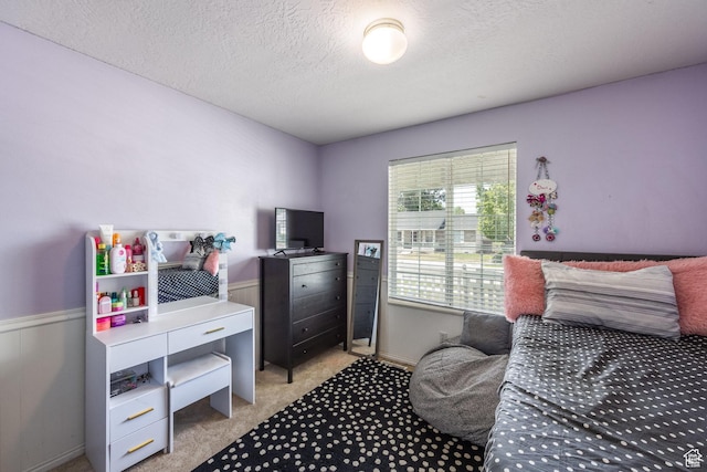 2080 E Fall St, Eagle Mountain, UT 84005 - bedroom with wainscoting, light colored carpet, and a textured ceiling