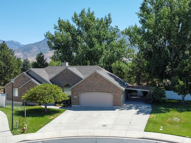643 E 140 N, American Fork, UT 84003 - ranch-style home featuring brick siding, concrete driveway, an attached garage, and a mountain view