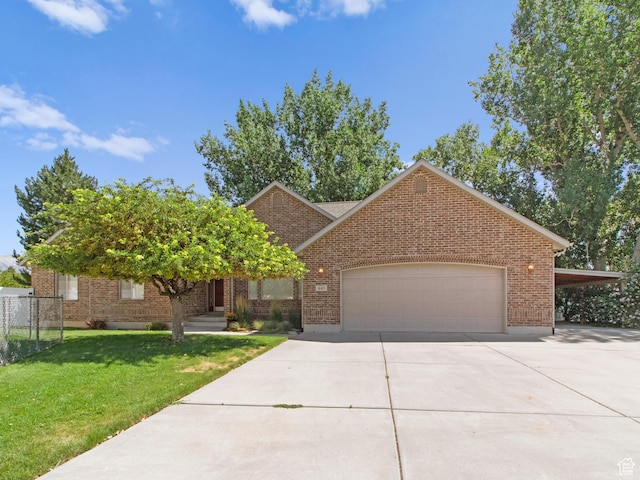 643 E 140 N, American Fork, UT 84003 - view of front of house with driveway, an attached garage, and brick siding