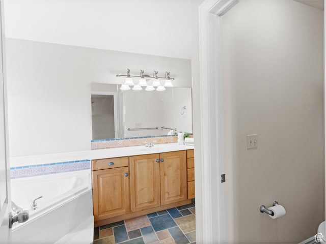 643 E 140 N, American Fork, UT 84003 - bathroom with vanity, a garden tub, and stone finish flooring