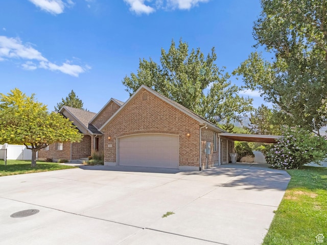 643 E 140 N, American Fork, UT 84003 - view of front of home featuring brick siding, driveway, a garage, and a carport