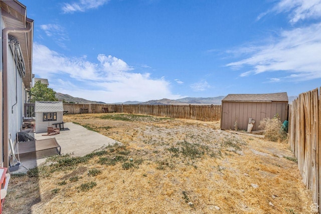 726 S 1050 W, Tooele, UT 84074 - fenced backyard featuring a patio, a shed, and a mountain view