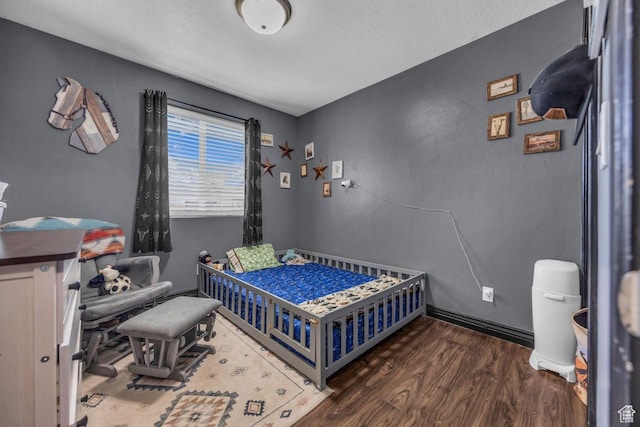 726 S 1050 W, Tooele, UT 84074 - bedroom with wood finished floors and a textured ceiling