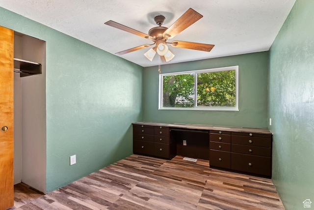 641 S 500 W, Brigham City, UT 84302 - unfurnished office with a textured wall, wood finished floors, and a ceiling fan