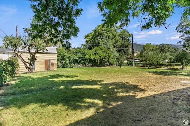 641 S 500 W, Brigham City, UT 84302 - view of green lawn with an outdoor structure