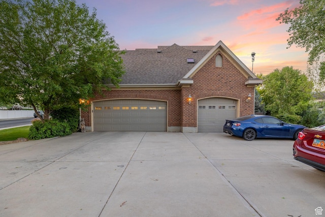192 E 2200 N, Lehi, UT 84043 - traditional-style home with concrete driveway, brick siding, a garage, and roof with shingles
