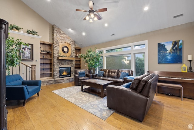 192 E 2200 N, Lehi, UT 84043 - living area featuring high vaulted ceiling, a ceiling fan, light wood-style flooring, a fireplace, and recessed lighting