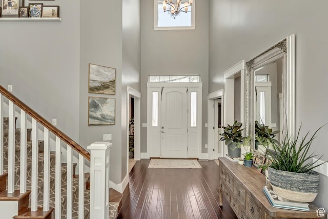 467 E Island View Cir N, Farmington, UT 84025 - foyer with a high ceiling, stairway, dark wood finished floors, and a chandelier