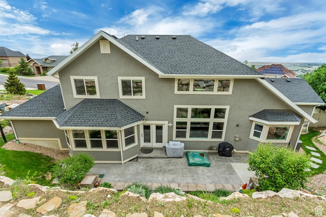 467 E Island View Cir N, Farmington, UT 84025 - rear view of property featuring a shingled roof, stucco siding, and a patio area