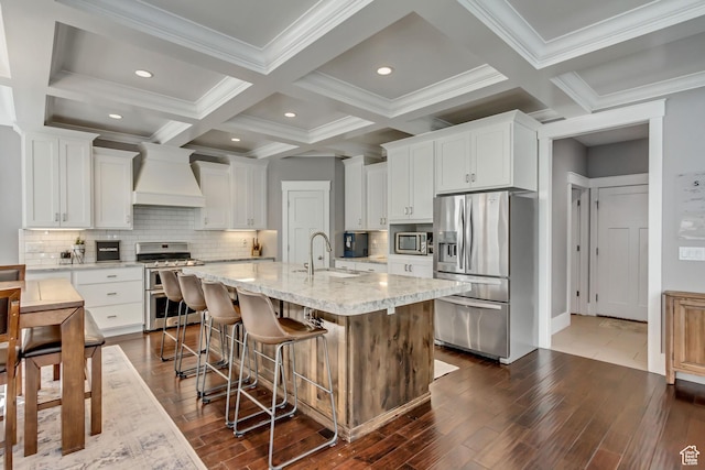 467 E Island View Cir N, Farmington, UT 84025 - kitchen featuring appliances with stainless steel finishes, custom range hood, dark wood-style floors, white cabinetry, and beam ceiling