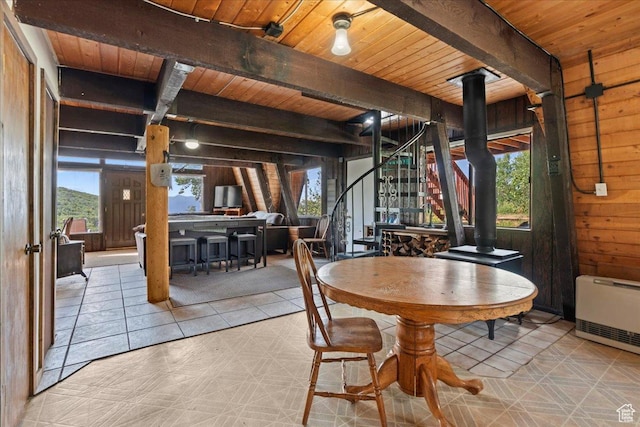 9406 Deer Creek Dr Unit 1074, Heber City, UT 84032 - dining area with a wooden ceiling with exposed beams, wooden walls, heating unit, tile patterned floors, and stairway