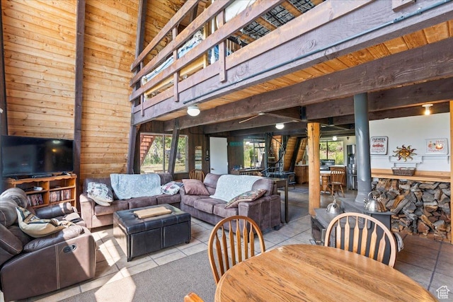 9406 Deer Creek Dr Unit 1074, Heber City, UT 84032 - tiled living room featuring wooden walls, plenty of natural light, wooden ceiling, and a high ceiling