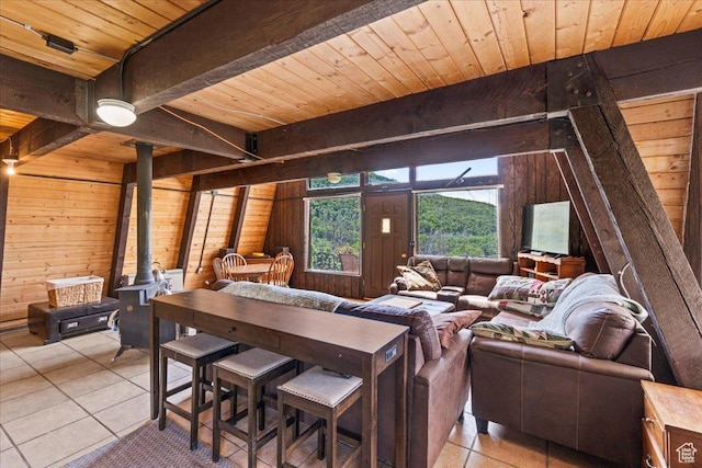 9406 Deer Creek Dr Unit 1074, Heber City, UT 84032 - living room featuring wooden walls, light tile patterned floors, a wood ceiling with exposed beams, and a wood stove
