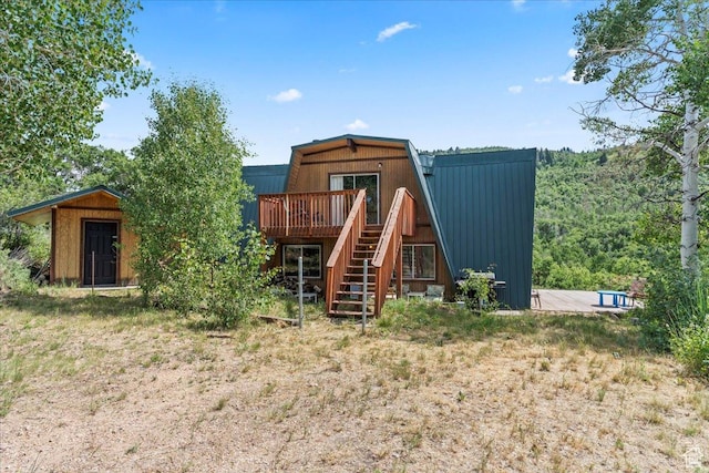 9406 Deer Creek Dr Unit 1074, Heber City, UT 84032 - rear view of house with a deck, stairway, a metal roof, and a storage shed
