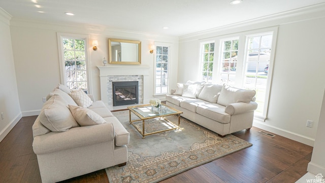 2295 E Woodchuck Way, Sandy, UT 84093 - living area with plenty of natural light, crown molding, a stone fireplace, wood-type flooring, and recessed lighting