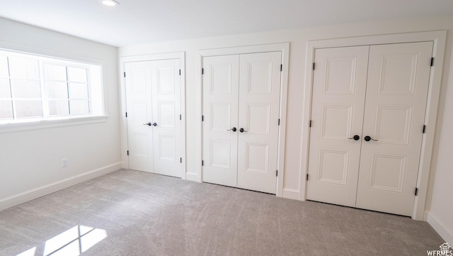 2295 E Woodchuck Way, Sandy, UT 84093 - unfurnished bedroom featuring multiple closets, carpet, and recessed lighting