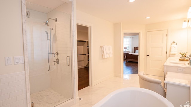 2295 E Woodchuck Way, Sandy, UT 84093 - ensuite bathroom with a stall shower, a freestanding bath, recessed lighting, and vanity