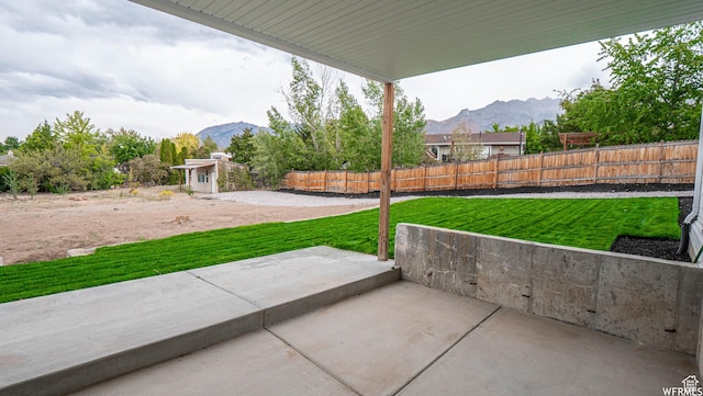 2295 E Woodchuck Way, Sandy, UT 84093 - fenced backyard with a mountain view and a patio