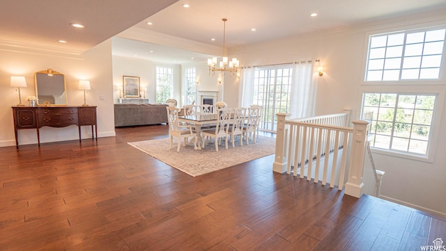 2295 E Woodchuck Way, Sandy, UT 84093 - dining area with dark wood finished floors, ornamental molding, a chandelier, and recessed lighting