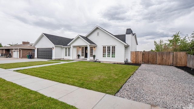 2295 E Woodchuck Way, Sandy, UT 84093 - view of front of home with driveway, an attached garage, a gate, and a chimney