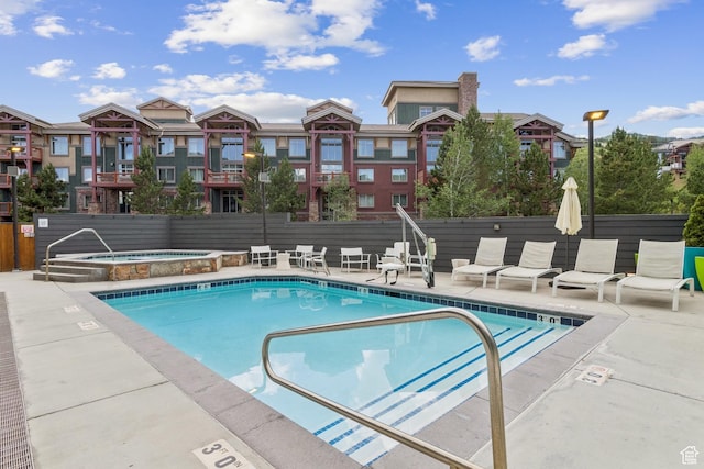 2670 Canyons Resort Dr Unit 417, Park City, UT 84098 - community pool featuring a community hot tub, a patio area, and a residential view