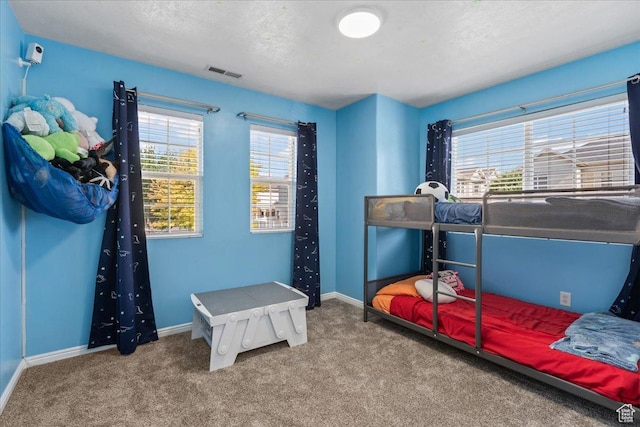 6801 W Tupelo Ln S, West Jordan, UT 84081 - carpeted bedroom with baseboards and a textured ceiling