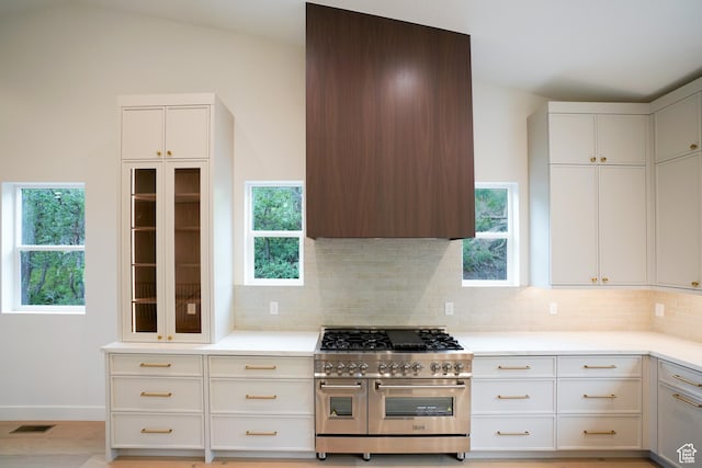 10135 E Clubhouse Rd, Heber City, UT 84032 - kitchen with double oven range, backsplash, light countertops, healthy amount of natural light, and vaulted ceiling