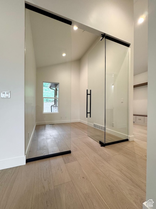 10135 E Clubhouse Rd, Heber City, UT 84032 - bathroom with wood finished floors, vaulted ceiling, and recessed lighting