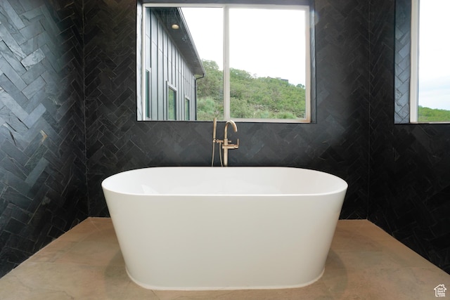 10135 E Clubhouse Rd, Heber City, UT 84032 - full bathroom featuring a freestanding bath and tile walls