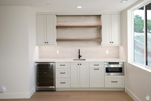 10135 E Clubhouse Rd, Heber City, UT 84032 - kitchen featuring wine cooler, open shelves, light wood-style flooring, light countertops, and recessed lighting