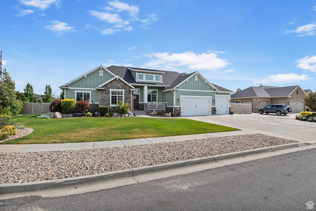 1455 W 600 S, Layton, UT 84041 - craftsman inspired home featuring board and batten siding, stone siding, an attached garage, and driveway