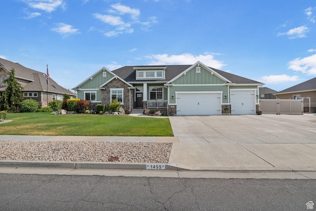 1455 W 600 S, Layton, UT 84041 - craftsman-style home with board and batten siding, an attached garage, driveway, and stone siding