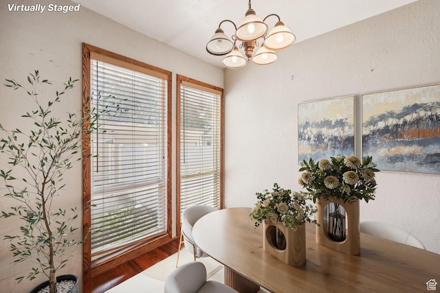 5249 S Gravenstein Park, Murray, UT 84123 - dining area with wood finished floors and a chandelier