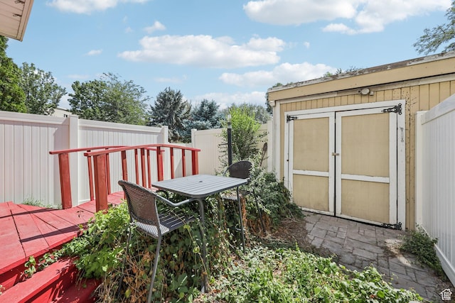 5249 S Gravenstein Park, Murray, UT 84123 - wooden deck with a storage shed and outdoor dining space