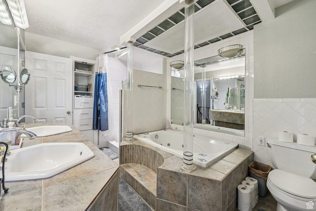 5249 S Gravenstein Park, Murray, UT 84123 - full bathroom with a tub with jets, tiled shower, double vanity, and tile walls