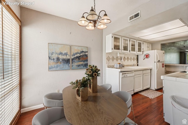 5249 S Gravenstein Park, Murray, UT 84123 - dining area featuring a chandelier and dark wood finished floors