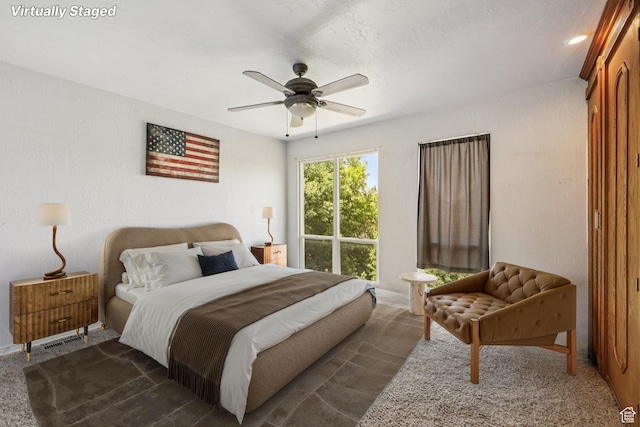 5249 S Gravenstein Park, Murray, UT 84123 - bedroom with dark colored carpet and ceiling fan