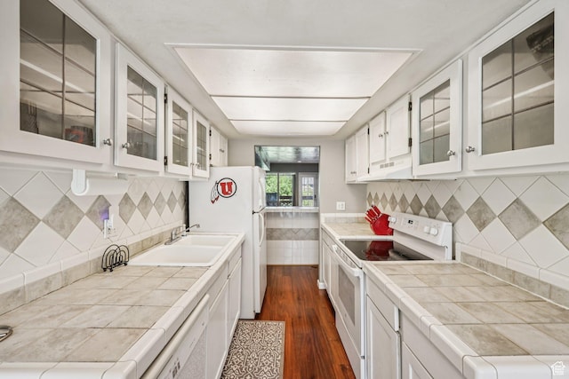 5249 S Gravenstein Park, Murray, UT 84123 - kitchen with white appliances, tile countertops, dark wood finished floors, white cabinets, and glass insert cabinets
