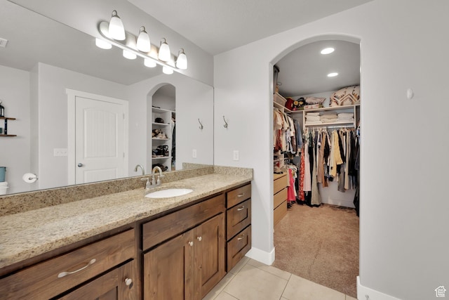 5295 S 4425 W, Hooper, UT 84315 - bathroom with vanity, a spacious closet, and tile patterned floors