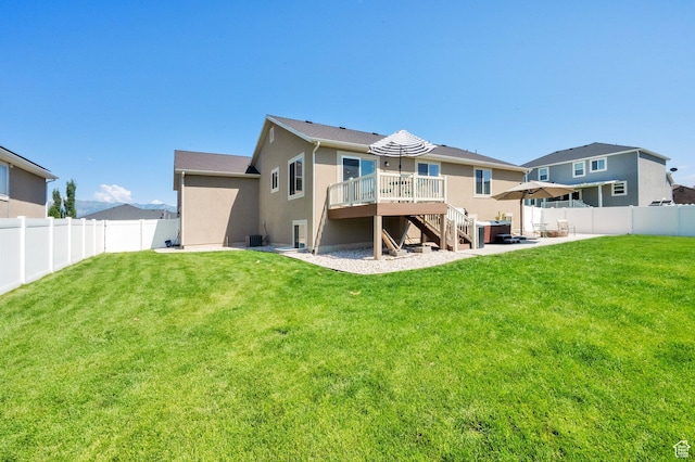 5295 S 4425 W, Hooper, UT 84315 - back of house with stairway, a fenced backyard, a wooden deck, and stucco siding