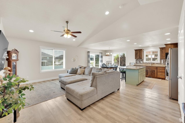 5295 S 4425 W, Hooper, UT 84315 - living room with vaulted ceiling, ceiling fan, light wood-style flooring, recessed lighting, and a chandelier